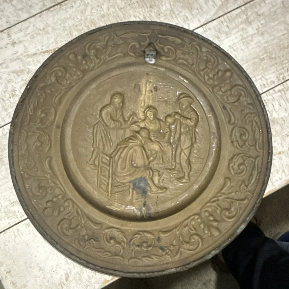 Vintage Brass plate with embossed scene and ornate detailing decorative metal